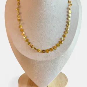 Liora Disc Necklace . stainless steel with 18k PVD plating