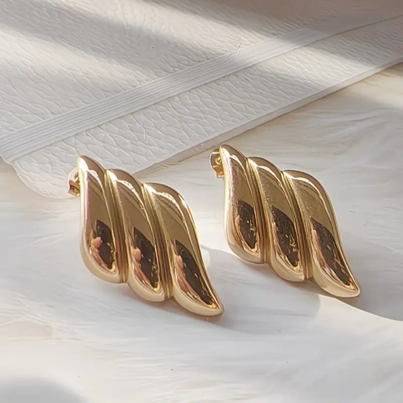 Aretes forma de alas, dorados de acero inoxidable