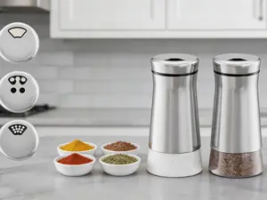 Adjustable glass salt and pepper shaker set with stainless steel accents. Multi-hole pouring design, farmhouse style for daily spice storage.