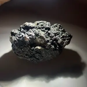 Dark manganese-coated crystal specimen