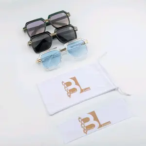 Clear and Gold Break Loose Sunglasses with Ice Blue lenses.