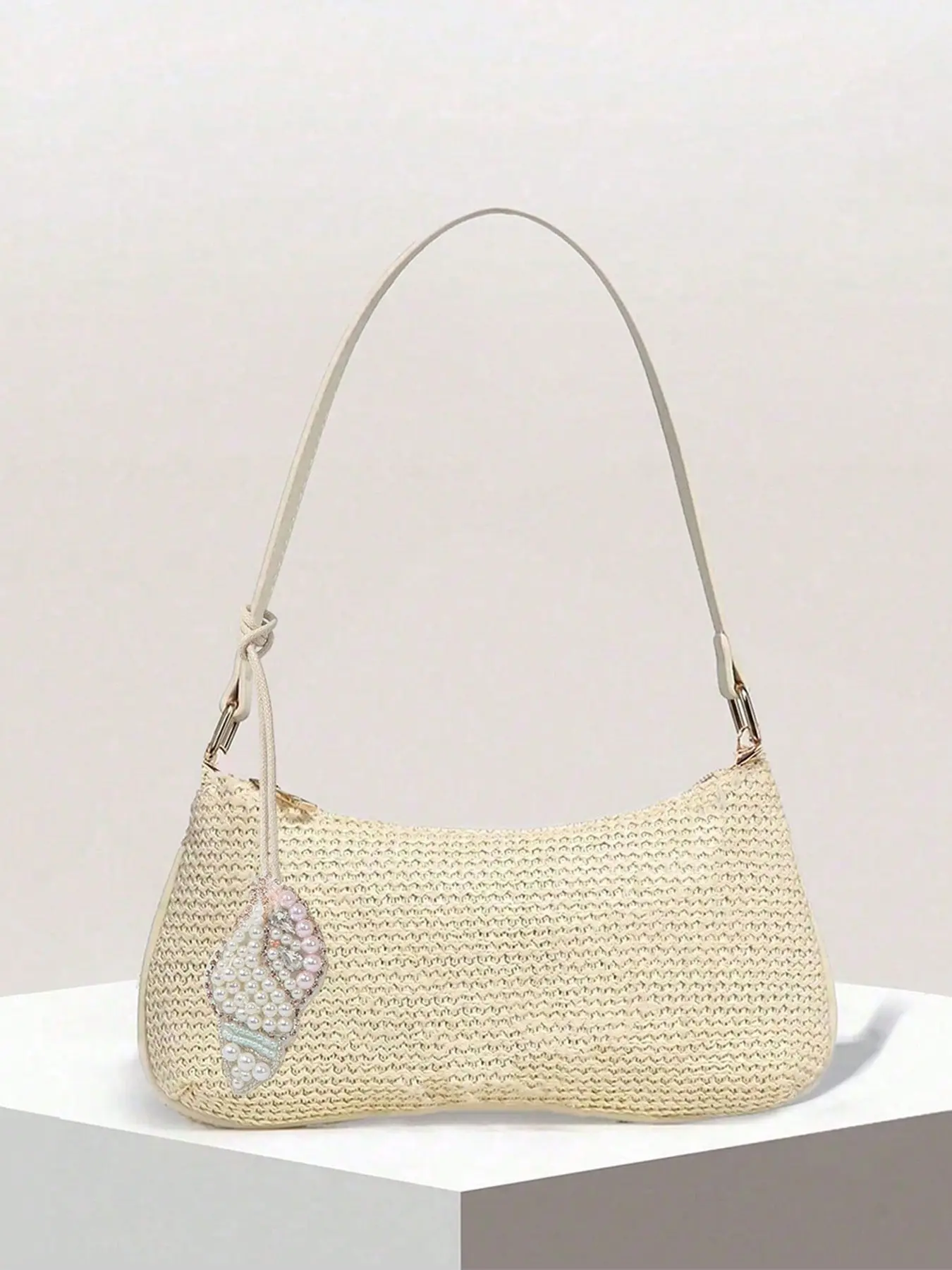 Vacation style practical texture simple grass woven armpit bag, retro niche personality high-end single shoulder bag, decorated with white conch pendant, suitable for outdoor play and daily commuting, Straw Bag