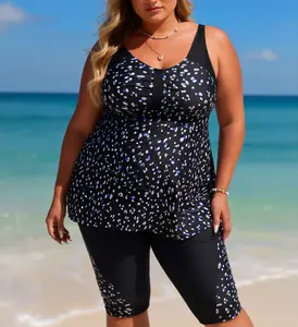 Plus Size Dotted Print Separated Swimsuit Flowy tankini top with ruched bust detail, paired with matching color-block swim capris. Sporty, full-coverage design for water activities Summer Vibes