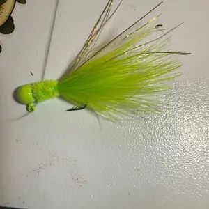 Indiana jig green head bright greener body white and green tail and gold flash