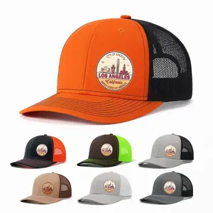 Gray & Black Trucker Style Baseball Cap - Gray Front Panel & Visor, Black Back Panel & Mesh Sections, Circular Emblem with 'CITY OF LOS ANGELES', 'LOS ANGELES', 'CALIFORNIA' in Red/Yellow Design - Plain White Background Highlighted Details