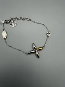 Pre-owned Louis Vuitton Louisette Bracelet Silver w/Gold Accent Stylish Chain Design with Fleur Shaped Pendant for Everyday Wear