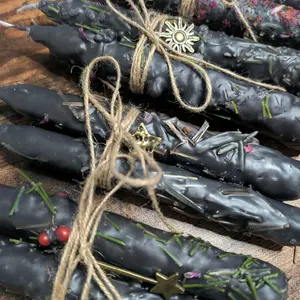 Hand Dressed Intention Candle with Delicate Floral Accents and Charm for Aesthetic Appeal Featuring Unique Twine Wrapping and Silver Sun Charm Decoration Ornaments