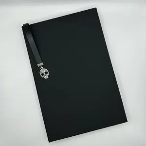 Fully black handmade lay flat hardcover journal with built in bookmark with skull charm