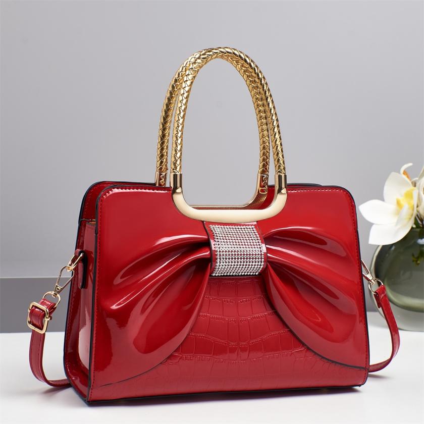Women’s glossy leather handbag with top handle — medium-structured shoulder/handbag with adjustable strap