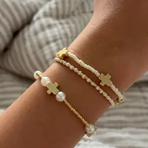 gold and white bracelet stack