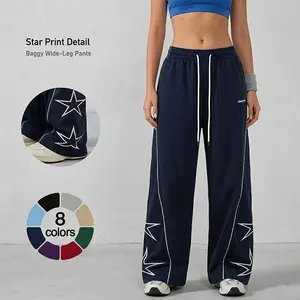 Women’s lightweight athletic pants with a soft, loose fit; oversized women’s long pants featuring gray side panels and five-pointed star prints; comfortable design in a sporty casual style—ideal for gym wear; unisex.