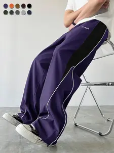 Men's contrasting color reflective strip wide-leg casual pants, pendant smooth fabric, side stripes, American high street style, daily commuting adaptation, trendy and versatile personality