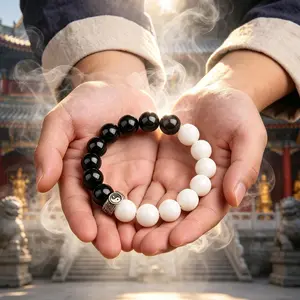 Crafted with grounding black obsidian and luminous white stone, this handcrafted bracelet shields your energy, clears mental clutter, and brings gentle harmony to your daily life.