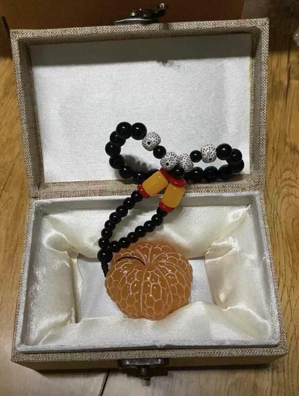 Oriental Gold Frozen Stone ornament, handheld piece, spinning craft item, souvenir gift, stress-relief spinning, hanging decoration, orange ornament