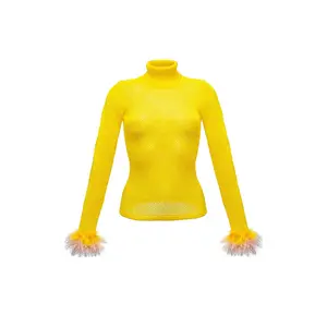 Yellow knit turtleneck with handmade knit details