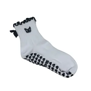 Black and white bow butterfly embroidered grip socks with heart grips for Pilates, barre, yoga or lagree