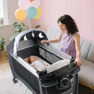 4-in-1 Foldable Baby Bed: A foldable double-layer bed with wheels, equipped with a diaper changing table and storage shelf inside, featuring a mosquito net and toy hanger - Gray/Black, a portable cradle | Solid frame structure