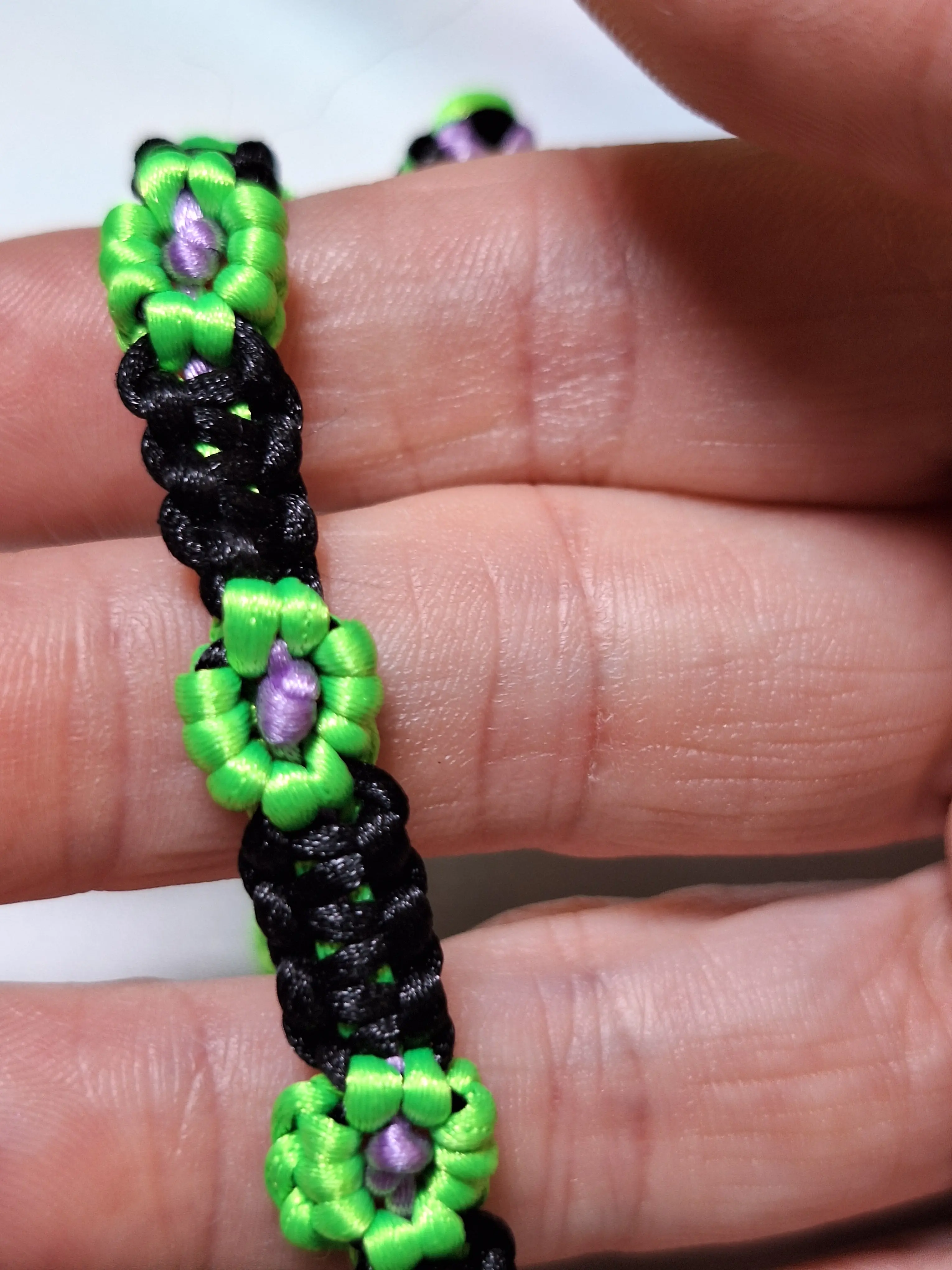 Green Silk Flower Bracelet - Purple Centers & Black Cord