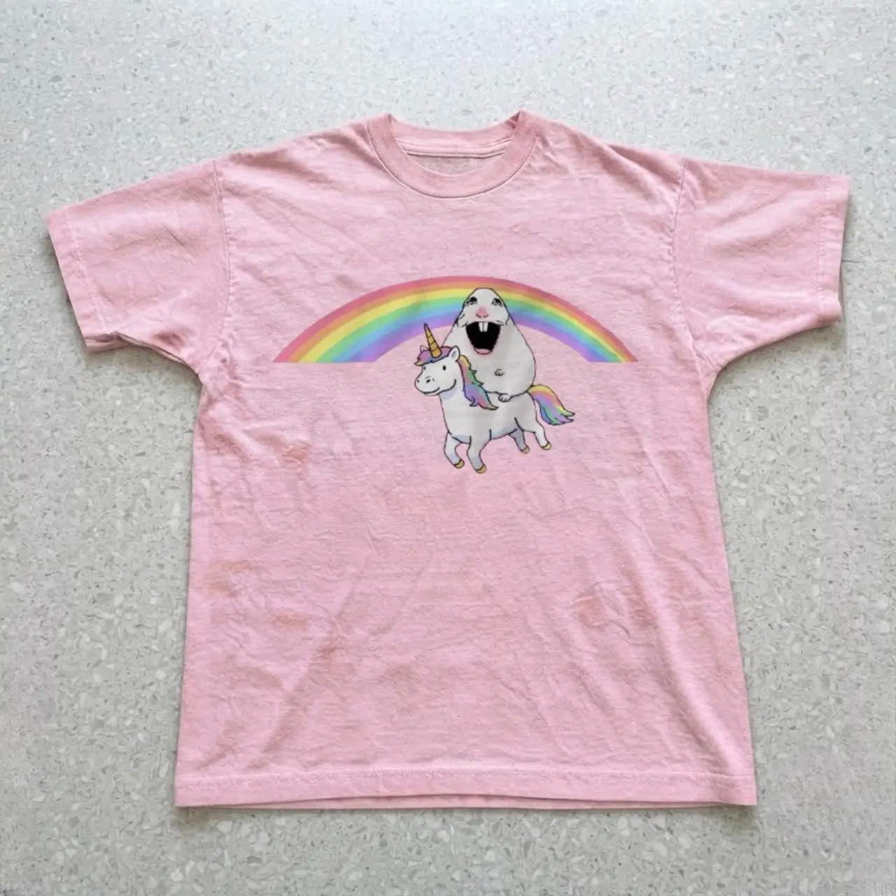 cute tee with graphic of a unicorn with a hamster above it