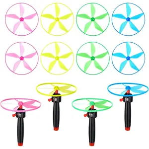 12 Pcs Flying Saucer Flying Disc Toy Helicopter Toy Disco Flyers Include 4 String Launchers and 8 Flying Saucer Flying Disc Launcher Flying Toys Little Teens Outdoor Activity Birthday Favors