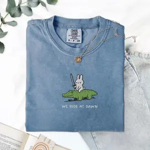 [MADE IN US] We Ride at Dawn T-Shirt, Bunny and Alligator Embroidered Tee, CC 1717, Funny Ren Faire Shirt, Whimsical Animal Top