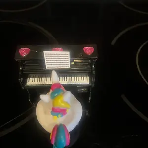 Unicorn rubber duck sitting at piano Unicorn rubber duck sitting at piano
