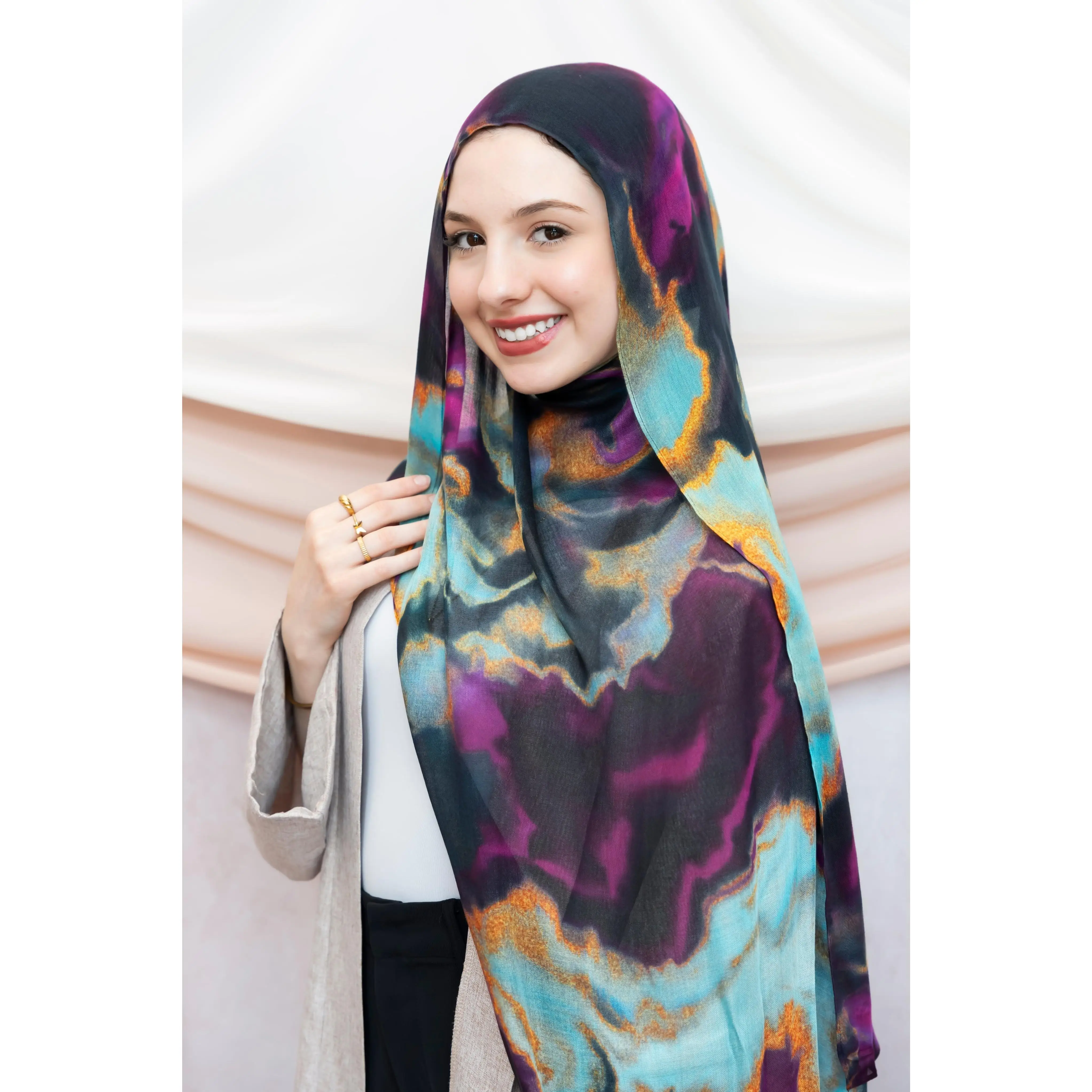Elevate your style with the Serene Aurora printed hijab—elegant, lightweight, an...