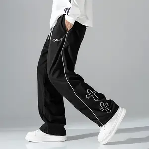 Men’s casual loose-fit athletic pants with a drawstring waistband and crisscross decorative design, suitable for teens and adults, versatile for all seasons.