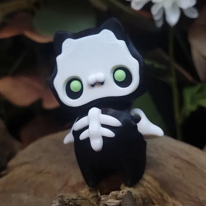 Skelli Pixie 3D Printed Articulated Fidget - Black & White Design with Green Eyes and Bat Wings