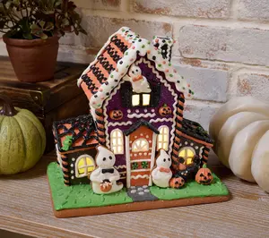 Illuminated Halloween House with Ghosts and Pumpkins by Valerie