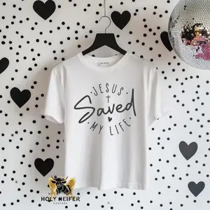 Holy Heifer’s Faith Based Tee - White Top with "JESUS SAVED MY LIFE" Design, Short Sleeve, Women's Wear - Womenswear