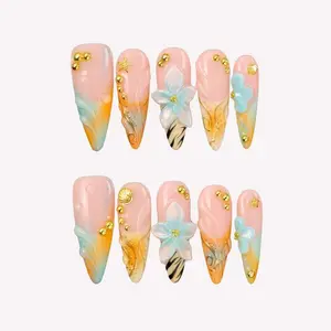 Ersa Nails Blossom Euphoria Long Oval Nails with 3D Floral Details and Gold Accents for Date Nights and Special Celebrations