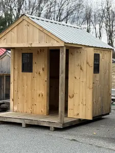 shed with a porch and window view