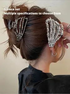 A Skull Hair Clip in The Shape Of A Skull Hand. A Sturdy Metal Structure That Tightly Grips The Hair. Avant Garde Gothic Style, Suitable for Festivals, Vintage Daily Dressing Up, and Halloween. A Cool Gift for Alternative Fashion Enthusiasts! Hair Claws