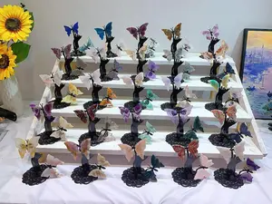 Handmade butterfly ornaments made from various materials including crystal