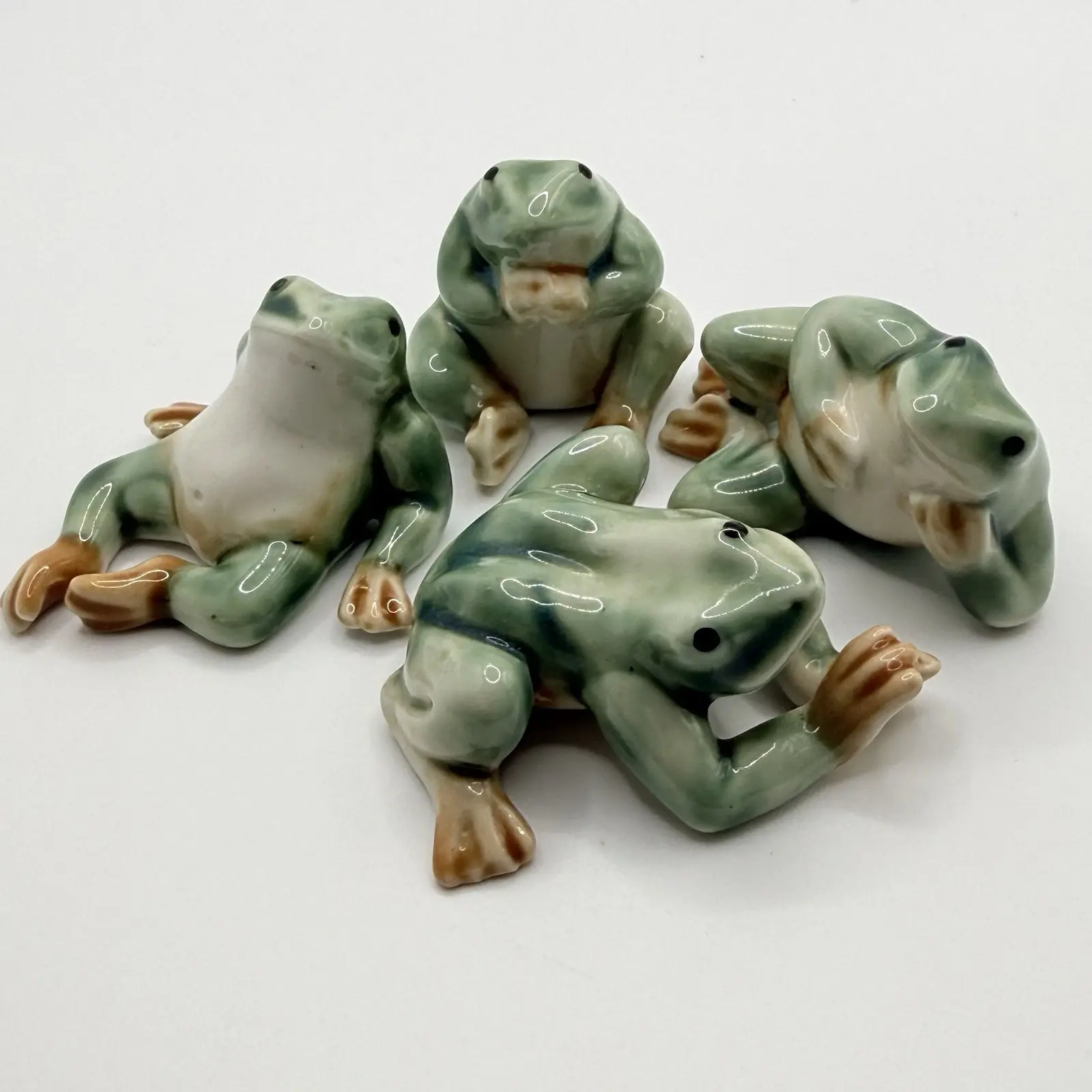 Lot of Four Relaxing Ceramic Frogs Figurines Chilling and Enjoying the Day