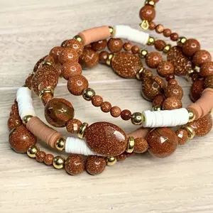 Memory Wire Bracelet with Brown Beads, Decorative Elements, and Unique Design