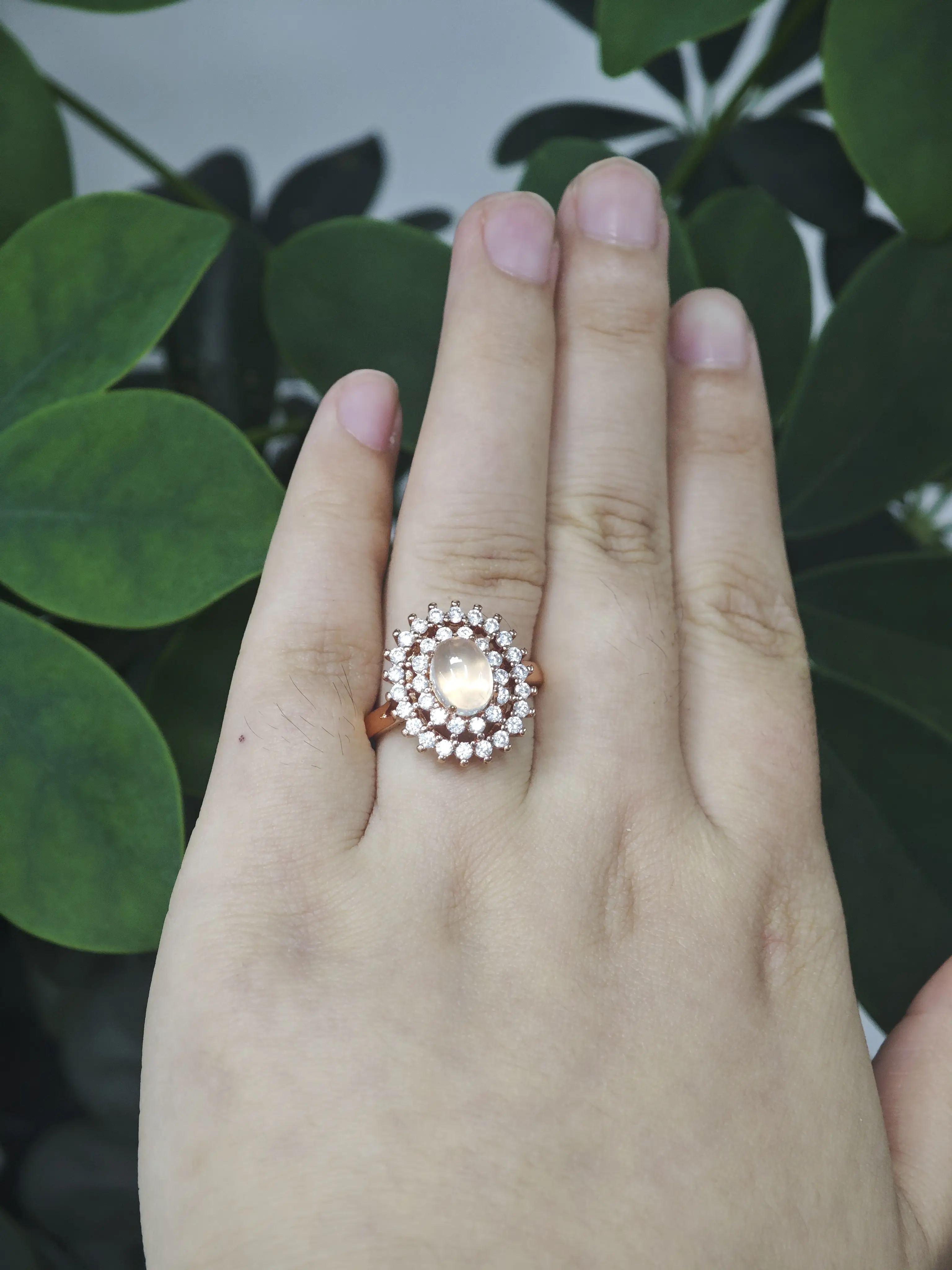 Casha(20458)gc.Rose‑gold ring with oval moonstone, double halo sparkling stones, gorgeous sun‑flower style.