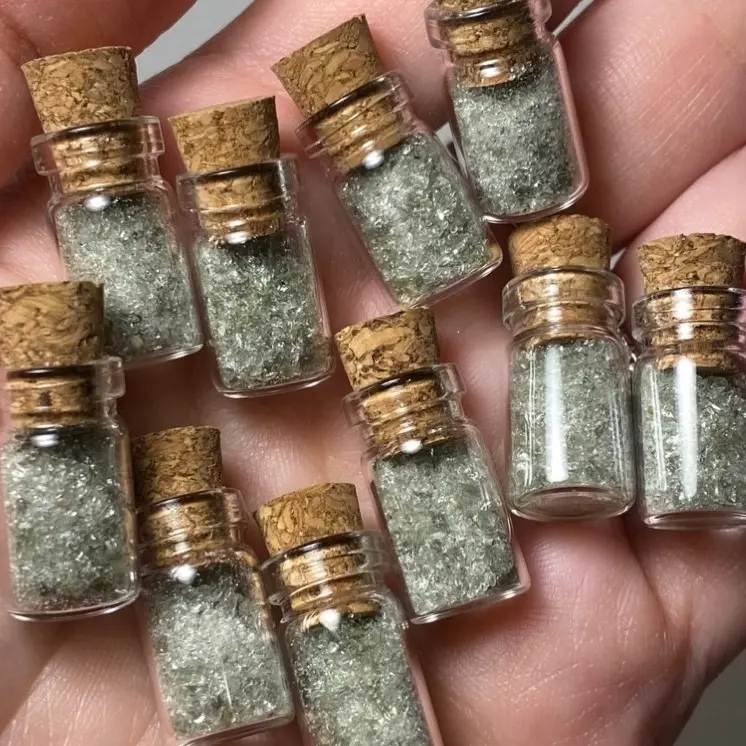 ONE mini glass vial of Moldavite Dust