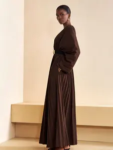 A women's deep brown V-neck long-sleeve pleated maxi dress, Elegant fitted dresses, Elegant Fashion Dress, paired with a belt to showcase an elegant look, suitable for formal occasions that require a refined presence, such as dinners, upscale parties