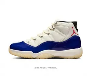 Premium white mesh with that iconic blue patent detail. A total grail Sneakers