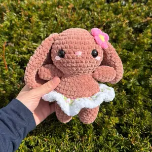Hand-crocheted brown blossom bunny with rose floral skirt