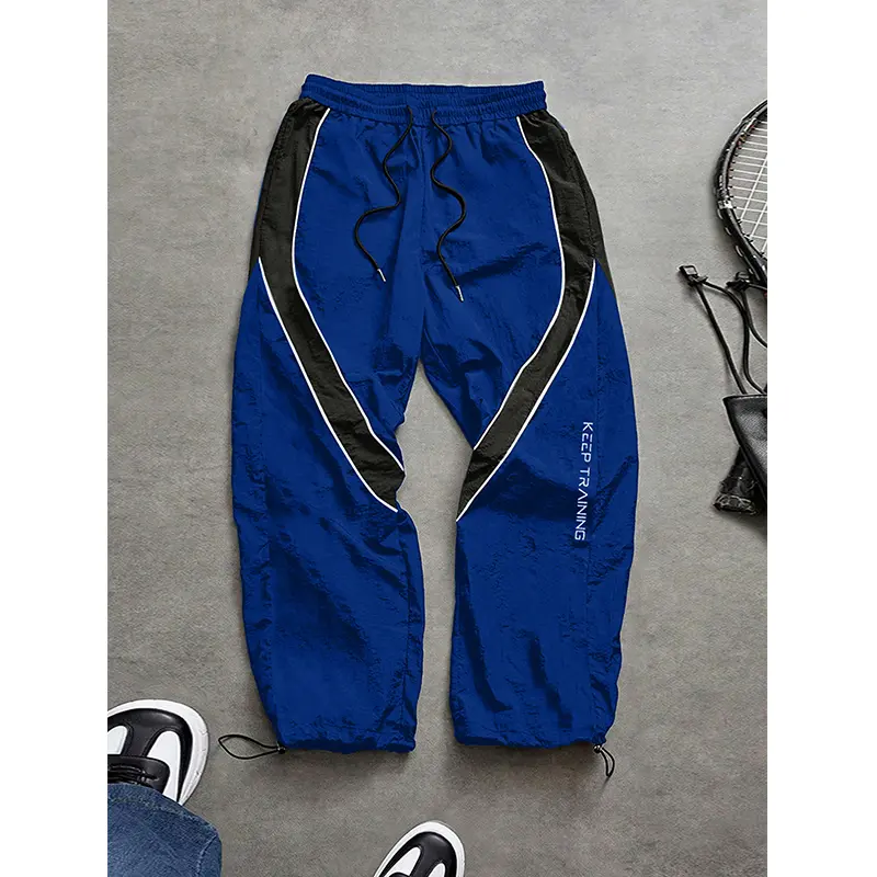 Men’s fashion letter-print casual athletic pants featuring side color-block panel design, loose fit; men’s jogging pants ideal for everyday casual wear, with a drawstring waist and adjustable elastic cuffs at the leg openings, suitable for outdoor hiking