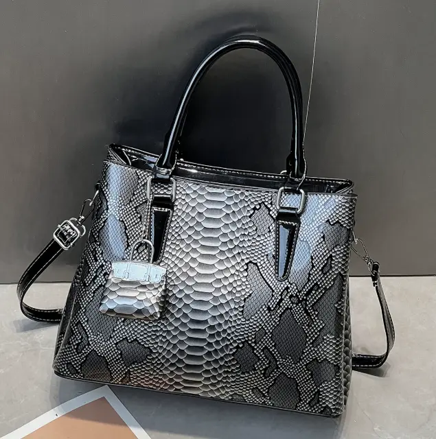 A169-Elegant Snake Print Handbag with Silver Lock Detail and Adjustable Strap A169-Elegant Snake Print Handbag with Silver Lock Detail and Adjustable Strap
