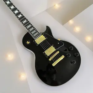 Black 6-string guitar, white binding, mahogany body, HH pickups, chrome hardware