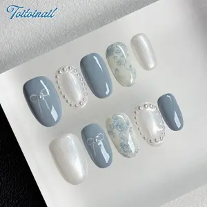 Misty Blue Handmade Press‑On Nails | Short Oval Shape, 10pcs | Dusty Blue & Pearl White Base with Vintage Blue Floral Print, Bow & Pearl Border Decor, Elegant Coquette Aesthetic, Ideal for Daily & Dating Wear, Reusable False Nails