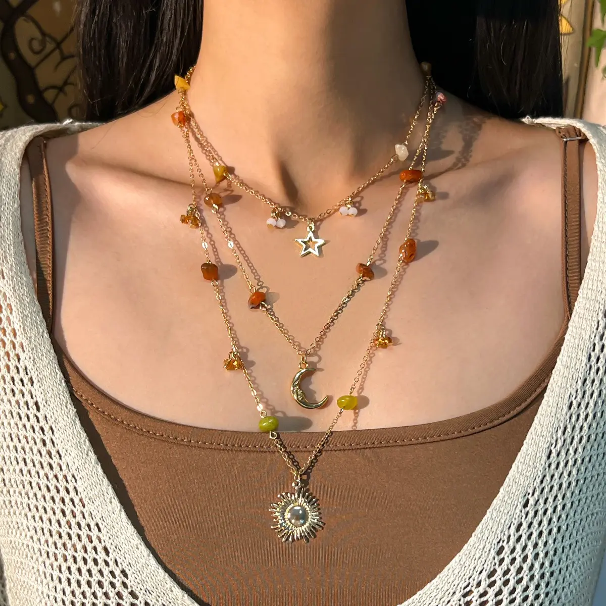 Stylish multi-layer necklace featuring colorful crushed stone accents and sun & moon pendants for women.