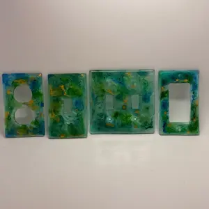 Custom Light Switch Face Plates in Vibrant Aqua and Teal with Unique Artistic Design for Home Decor