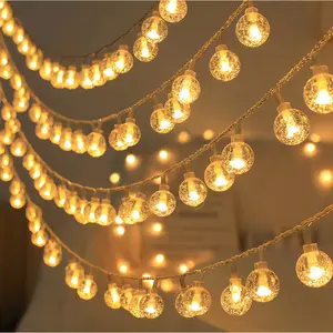 Solar-powered set of 100 LED crystal ball bubble lights—ideal for everyday outdoor gardens, camping, parties, birthdays, and holidays; includes various elegant cream-colored hanging decorations.