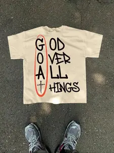Beige Faith-Inspired Graphic Tee — Hot-Selling Streetwear, Casual! ‘God Over All Things’ Print + Cross Detail, Oversized Fit For Urban Edgy Style. Trendy Statement Top.
